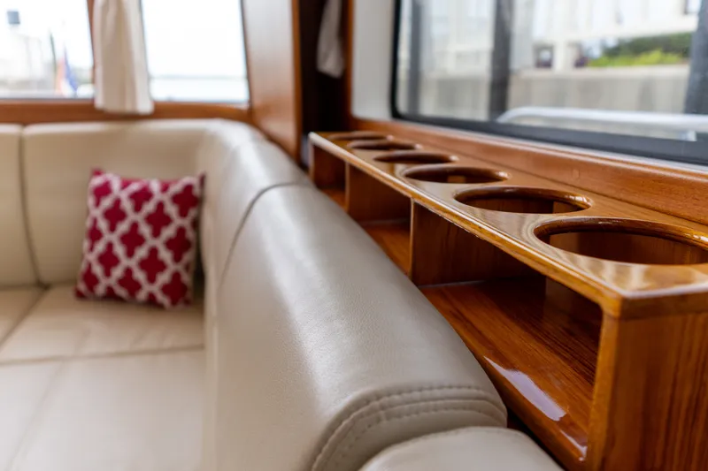 Slide: The Image of Luxurious interior of 2009 Grand Banks 45 Eastbay SX with leather seating and wooden cup holders. - 46