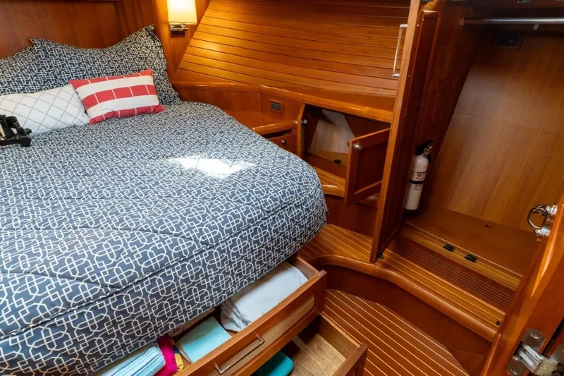 Slide: The Image of Luxurious 2009 Grand Banks 45 Eastbay SX cabin with cozy bed and wooden interior. - 72