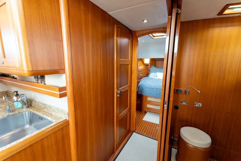Slide: The Image of Luxurious wooden interior of 2009 Grand Banks 45 Eastbay SX yacht cabin. - 65