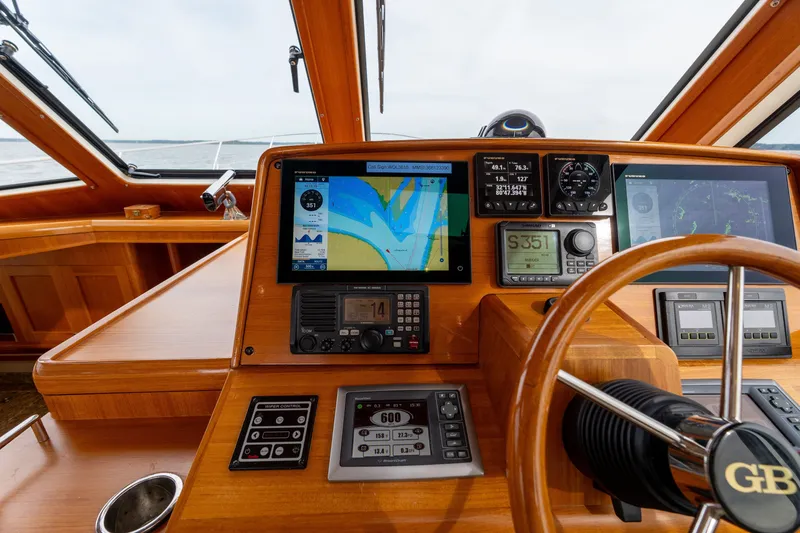 Slide: The Image of Helm of 2009 Grand Banks 45 Eastbay SX with navigation screens and controls. - 29