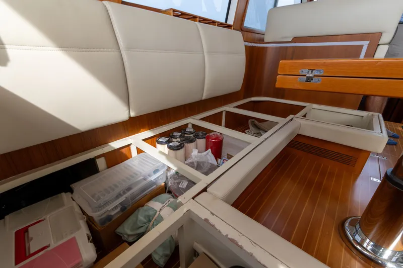 Slide: The Image of Under-seat storage on 2009 Grand Banks 45 Eastbay SX yacht, featuring organized compartments. - 44