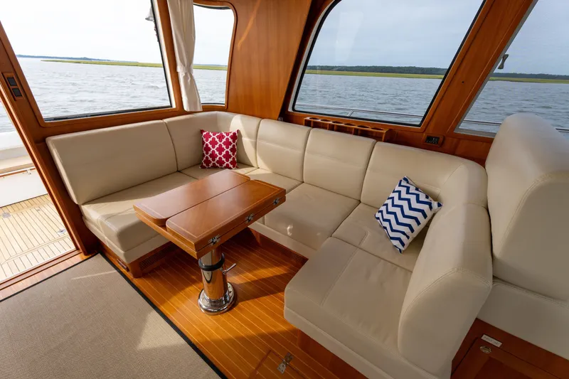 Slide: The Image of Luxurious interior of 2009 Grand Banks 45 Eastbay SX yacht with elegant seating and scenic view. - 40