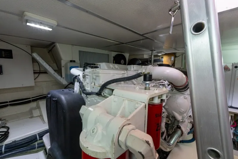 Slide: The Image of Engine room of 2009 Grand Banks 45 Eastbay SX yacht, showcasing mechanical components. - 82