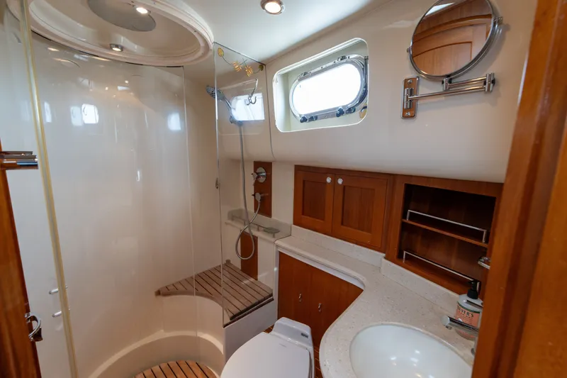 Slide: The Image of Luxurious bathroom interior of 2009 Grand Banks 45 Eastbay SX yacht with shower and wooden accents. - 77
