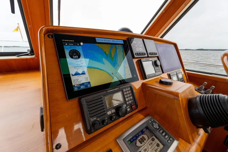 Slide: The Image of 2009 Grand Banks 45 Eastbay SX helm with navigation equipment and sea view. - 28