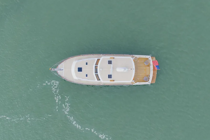 Slide: The Image of Aerial view of 2009 Grand Banks 45 Eastbay SX yacht on calm water. - 90