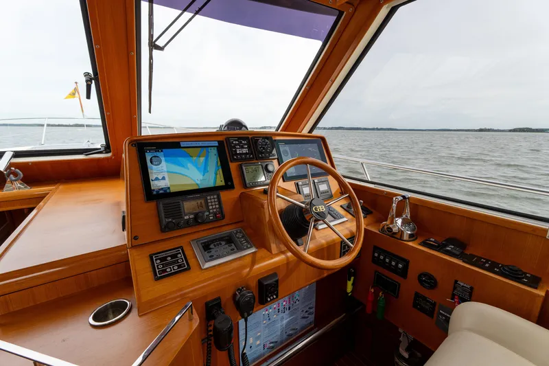 Slide: The Image of Helm of 2009 Grand Banks 45 Eastbay SX yacht with navigation equipment and wooden finish. - 27