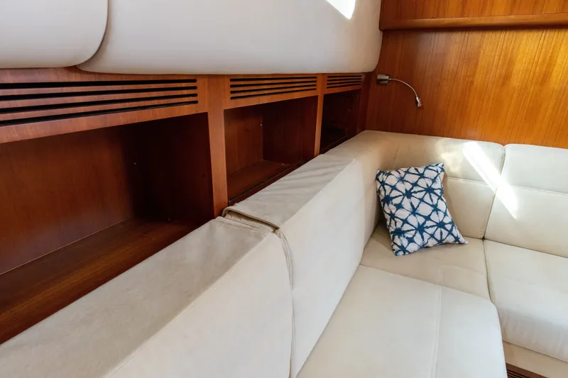 Slide: The Image of Interior of 2009 Grand Banks 45 Eastbay SX with beige seating and decorative pillow. - 63