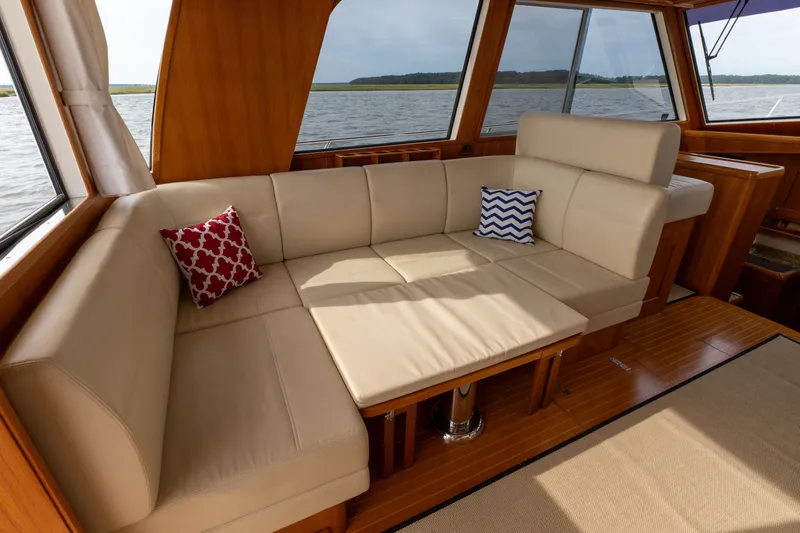 Slide: The Image of Luxurious interior of 2009 Grand Banks 45 Eastbay SX yacht with beige seating and decorative pillows. - 41