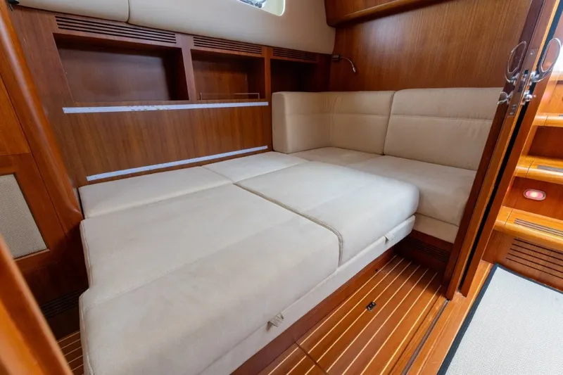 Slide: The Image of Luxurious interior of 2009 Grand Banks 45 Eastbay SX with beige seating and wooden accents. - 61