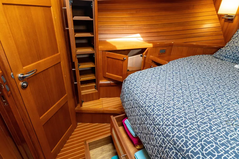 Slide: The Image of Luxurious wooden cabin interior of 2009 Grand Banks 45 Eastbay SX yacht with cozy bedding. - 73