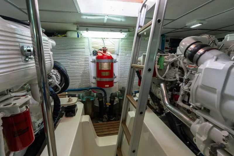 Slide: The Image of Engine room of 2009 Grand Banks 45 Eastbay SX with ladder and fire extinguisher. - 80