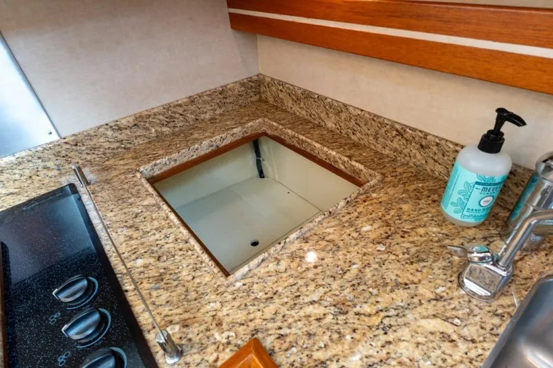 Slide: The Image of Granite countertop in 2009 Grand Banks 45 Eastbay SX yacht kitchen with soap dispenser. - 55