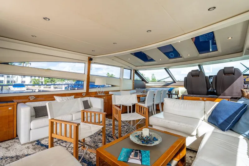 Slide: The Image of Luxurious interior of 2010 Princess V78 yacht with elegant seating and panoramic windows. - 21