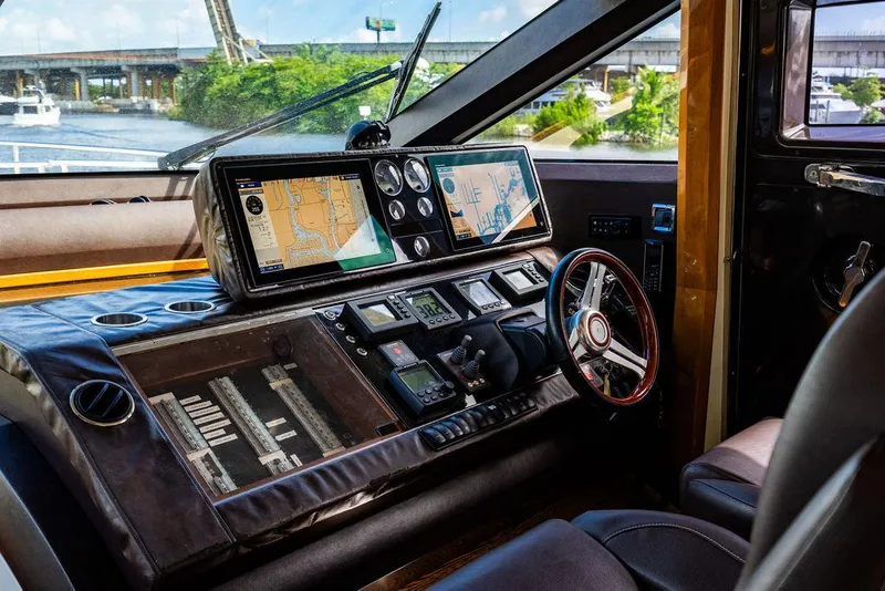 Slide: The Image of Luxurious 2010 Princess V78 yacht cockpit with advanced navigation systems and leather steering wheel. - 26