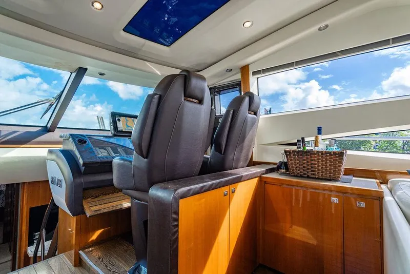 Slide: The Image of Luxurious 2010 Princess V78 yacht interior with leather seats and panoramic windows. - 24