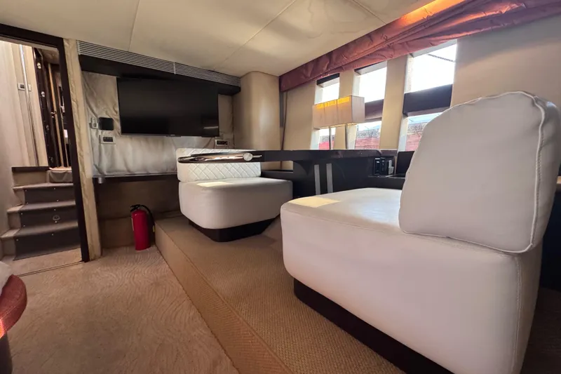 Slide: The Image of Luxurious interior of a 2006 Azimut 68S yacht with modern seating and decor. - 77