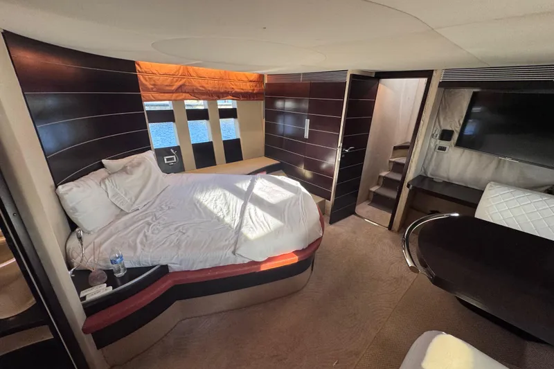 Slide: The Image of Luxurious interior of 2006 Azimut 68S yacht with modern bedroom and elegant furnishings. - 70