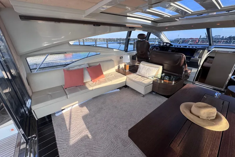Slide: The Image of Luxurious interior of a 2006 Azimut 68S yacht with elegant seating and panoramic windows. - 22