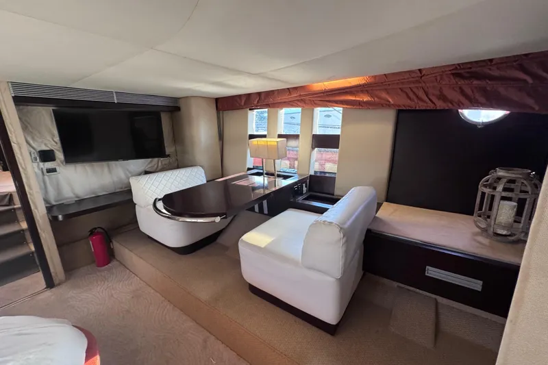 Slide: The Image of Luxurious interior of a 2006 Azimut 68S yacht with elegant seating and modern decor. - 75
