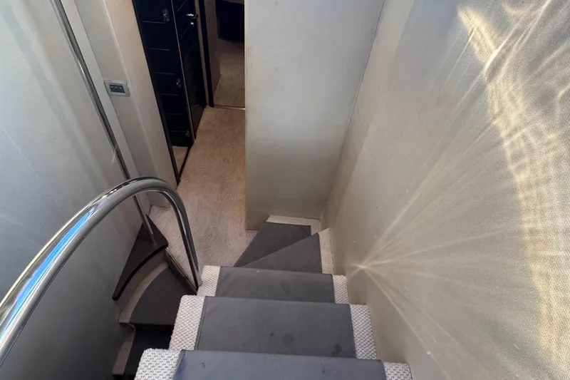 Slide: The Image of Staircase inside 2006 Azimut 68S yacht with sleek design and modern interior. - 47
