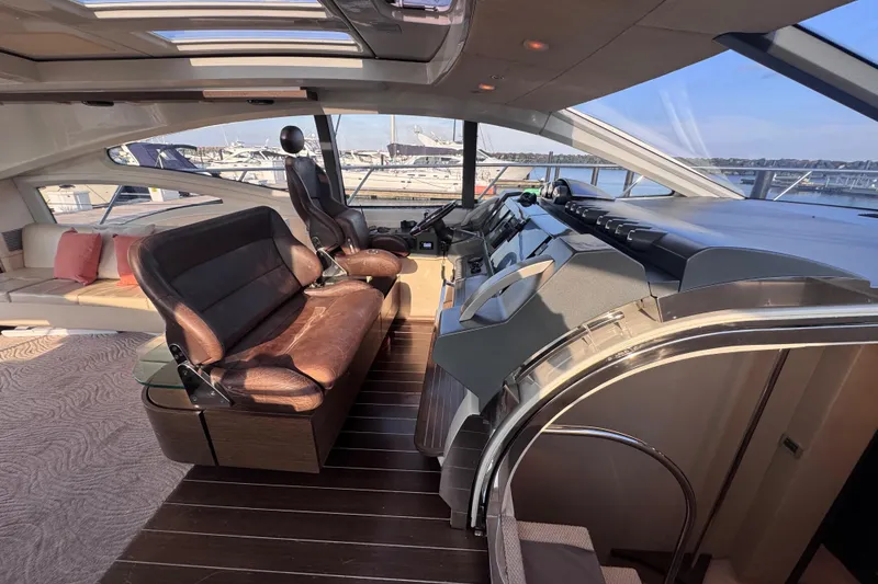 Slide: The Image of Luxurious interior of a 2006 Azimut 68S yacht with leather seating and panoramic windows. - 17