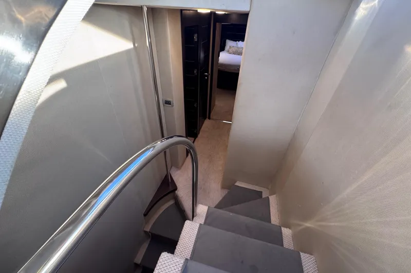 Slide: The Image of Staircase leading to a bedroom in a 2006 Azimut 68S yacht interior. - 45