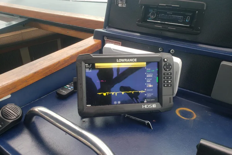 Slide: The Image of Lowrance HDS-9 fishfinder on 1988 Sea Ray 390 Express Cruiser dashboard. - 18