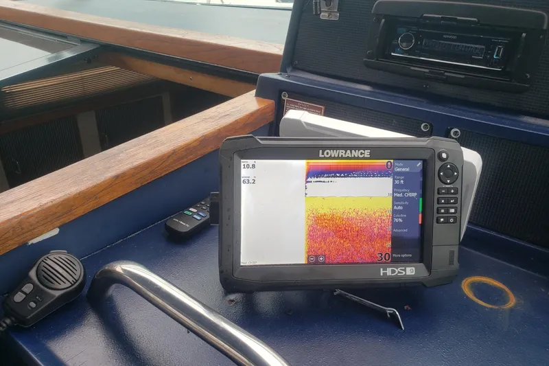 Slide: The Image of Lowrance HDS-9 fishfinder on 1988 Sea Ray 390 Express Cruiser dashboard. - 21