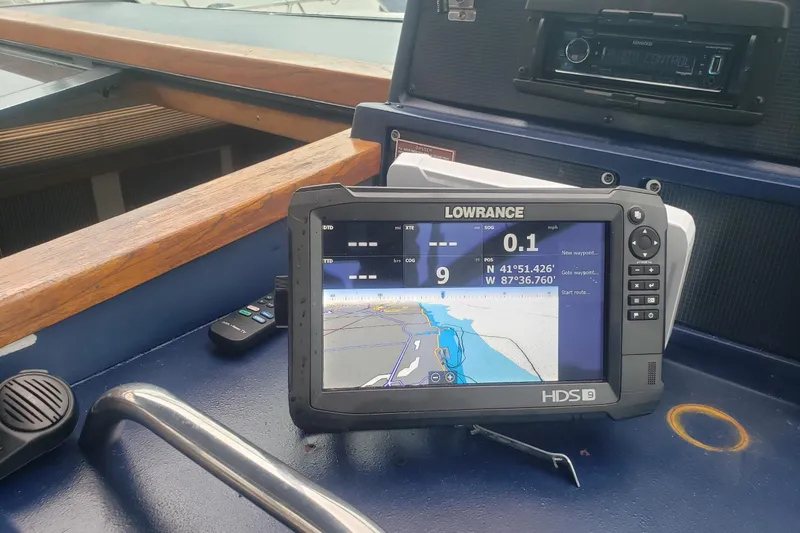 Slide: The Image of Lowrance HDS-9 navigation system on 1988 Sea Ray 390 Express Cruiser dashboard. - 17