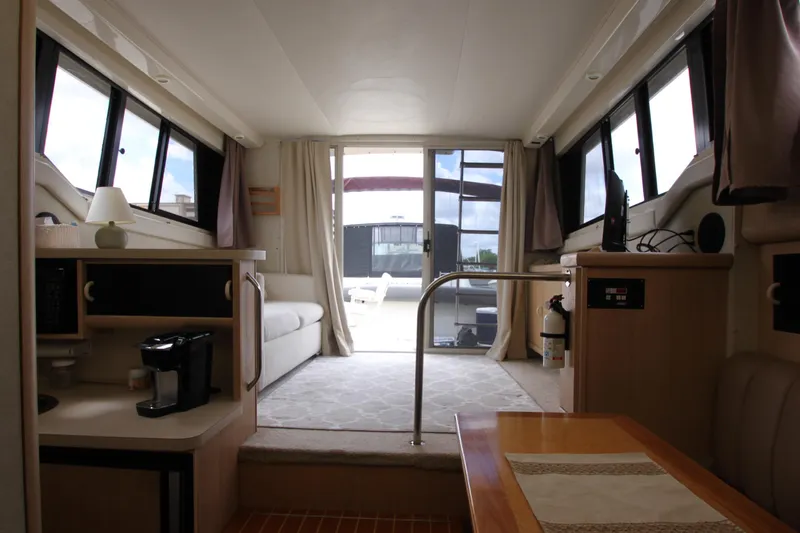 Slide: The Image of Interior of 1990 Silverton 34 Convertible yacht with modern amenities and spacious layout. - 18