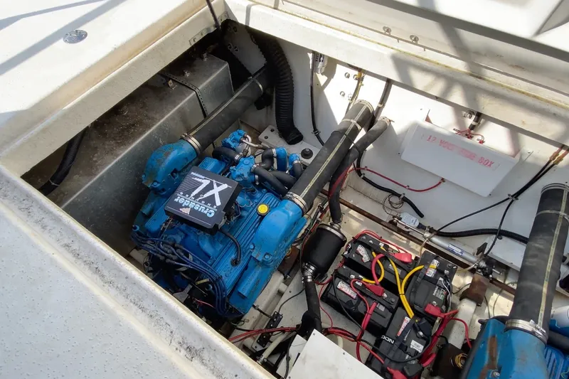 Slide: The Image of Engine compartment of a 2000 Gibson 37 Sport Series boat, featuring Crusader XL engine. - 24