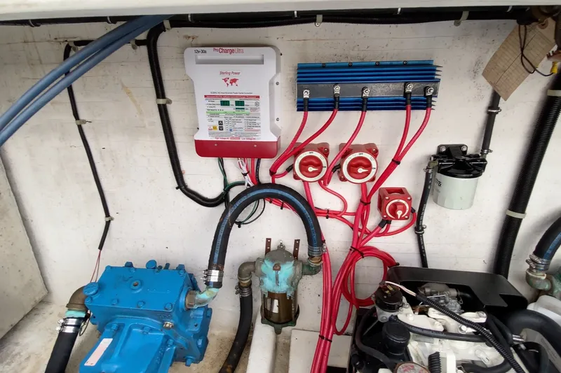 Slide: The Image of Electrical system setup in a 2000 Gibson 37 Sport Series boat engine room. - 27