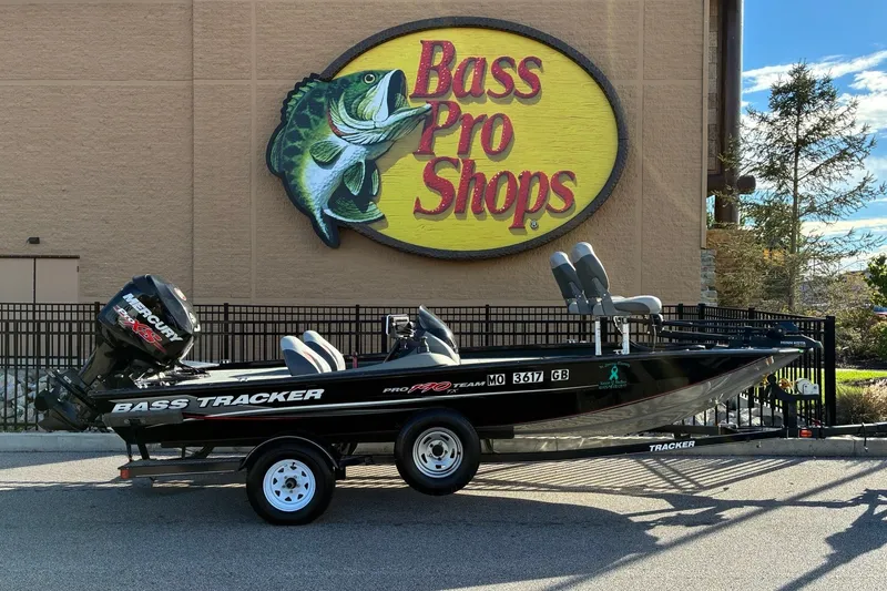 The Image of 2014 Tracker Pro Team 190 TX boat displayed outside Bass Pro Shops. - 0