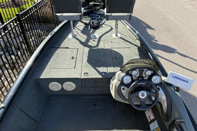 Slide: The Image of 2014 Tracker Pro Team 190 TX boat interior with steering console and Lowrance device. - 13