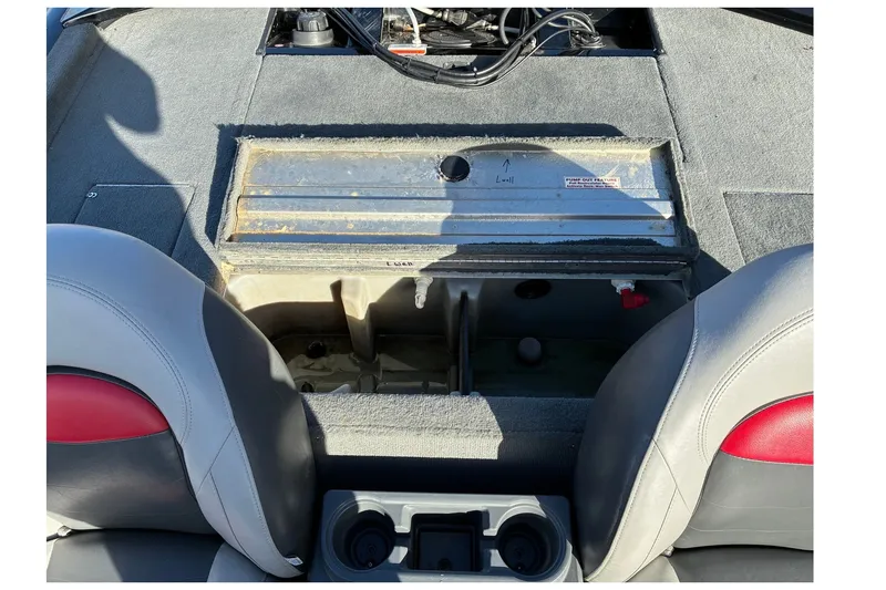 Slide: The Image of 2014 Tracker Pro Team 190 TX boat interior with open storage compartment. - 17