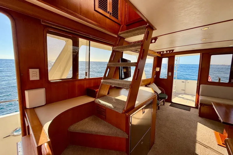 Slide: The Image of Interior of 1997 Offshore Yachts 48 Sedan with ocean view and wooden finishes. - 44