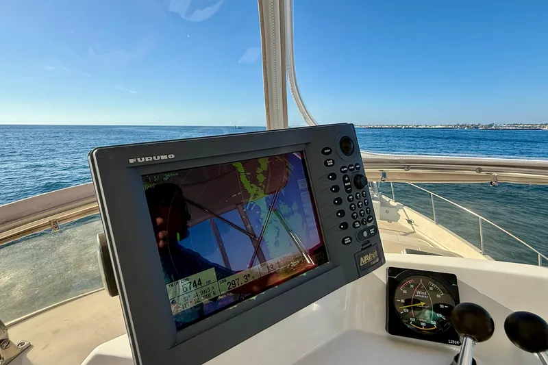 Slide: The Image of Navigation equipment on 1997 Offshore Yachts 48 Sedan, overlooking the ocean. - 66