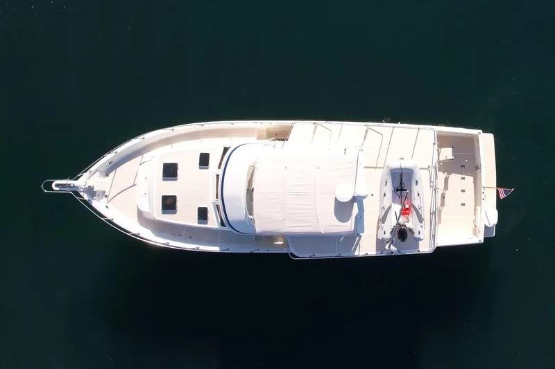 Slide: The Image of Aerial view of 1997 Offshore Yachts 48 Sedan on calm water. - 14