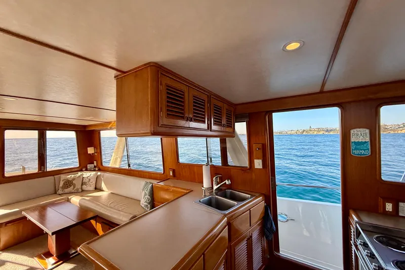 Slide: The Image of Interior of 1997 Offshore Yachts 48 Sedan with ocean view through windows. - 51