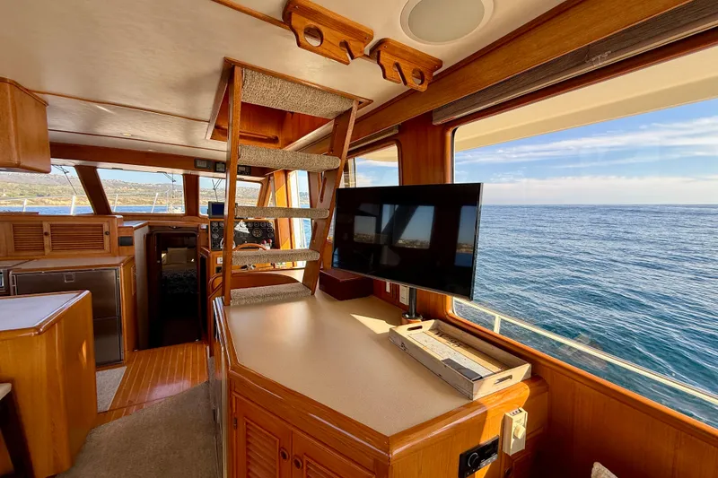 Slide: The Image of Interior of 1997 Offshore Yachts 48 Sedan with ocean view and modern amenities. - 39