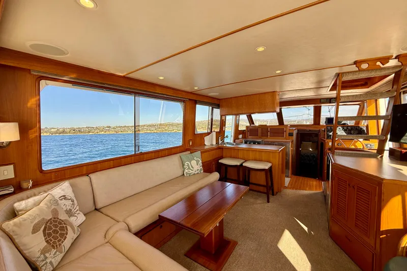 Slide: The Image of Luxurious interior of 1997 Offshore Yachts 48 Sedan with scenic ocean view. - 38