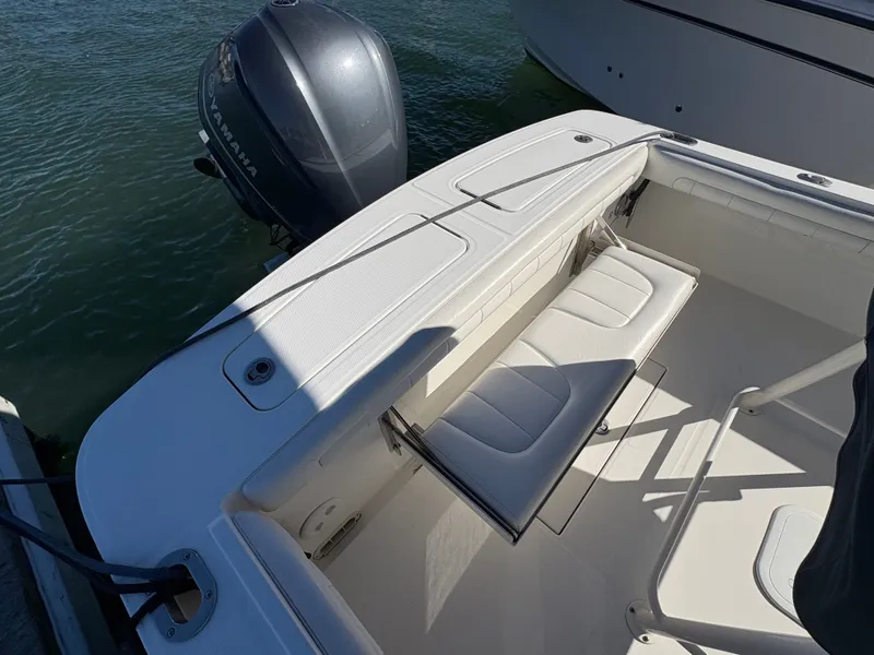 Slide: The Image of The image shows the stern of a 2017 Regulator 23 boat with a Yamaha outboard motor. - 10