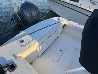 Slide: The Image of The image shows the stern of a 2017 Regulator 23 boat with a Yamaha outboard motor. - 9