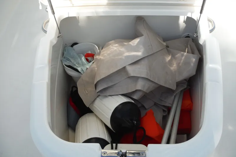 Slide: The Image of Storage compartment of 2020 Boston Whaler 270 Dauntless with boating gear and accessories. - 25