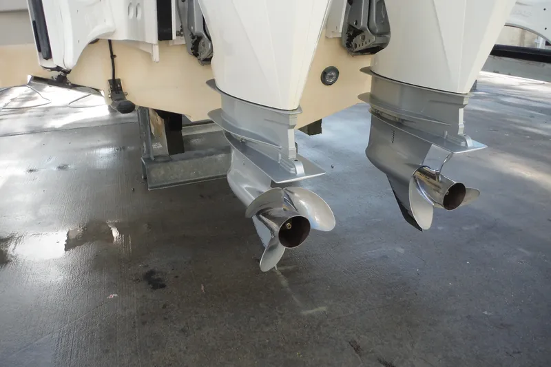 Slide: The Image of Twin outboard motors on a 2020 Boston Whaler 270 Dauntless boat. - 46