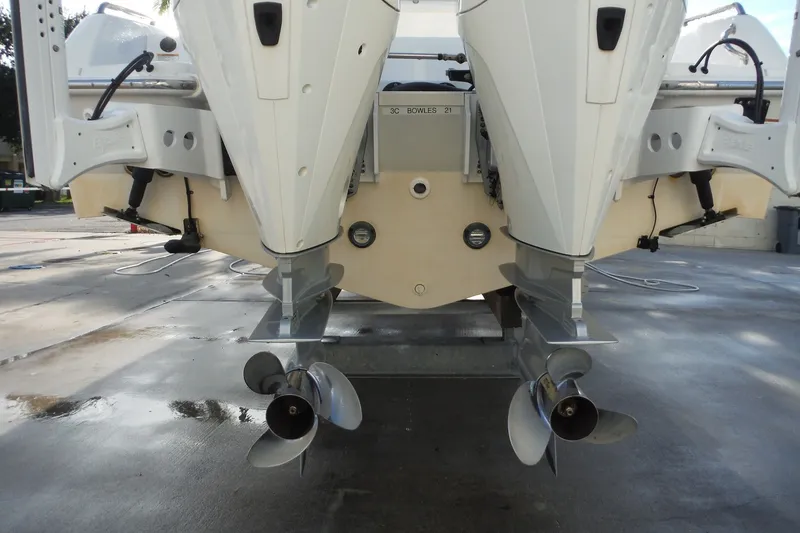 Slide: The Image of Rear view of 2020 Boston Whaler 270 Dauntless with dual outboard motors. - 47