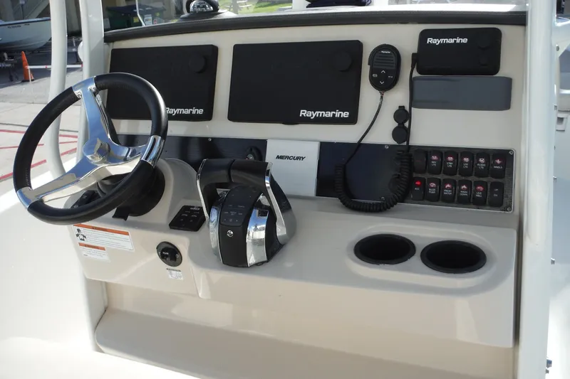 Slide: The Image of 2020 Boston Whaler 270 Dauntless helm with Raymarine electronics and Mercury controls. - 18