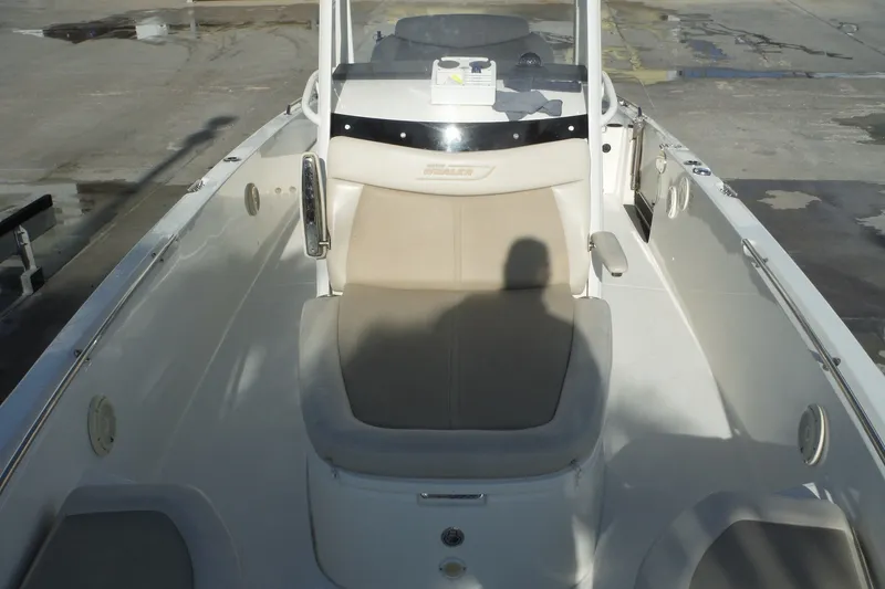 Slide: The Image of 2020 Boston Whaler 270 Dauntless boat interior with seating and console. - 23