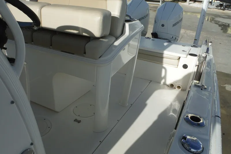 Slide: The Image of 2020 Boston Whaler 270 Dauntless boat interior with seating and dual Mercury engines. - 42
